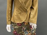 an image of a mannequin wearing a yellow jacket and skirt