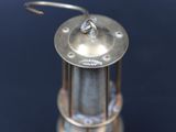 a small metal object with a hook on top of it