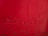 a close up of the bottom of a red machine