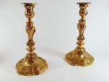 pair of antique brass candlesticks in the style of person