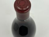 a bottle of wine that is sitting on a table
