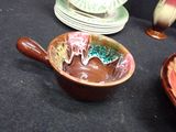 many plates and bowls that are on the table