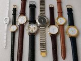 a lot of watches that are sitting on a table