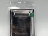 a close up of a piece of plastic with a toothbrush in it