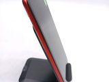 a cell phone that is sitting on a stand