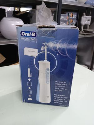 a box that has a toothbrush in it on a table