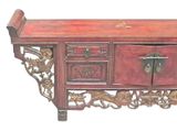 a wooden table with a drawer and a drawer on it