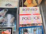 many books on display on a table in a case