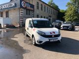 a white van that is parked in front of a building