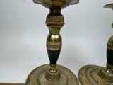 two candles that are sitting on a table