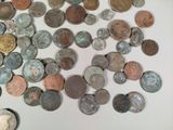a lot of coins that are on the table