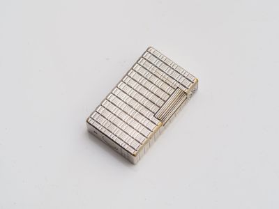 a lighter that is sitting on a white surface
