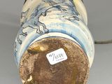 a blue and white vase with a horse on it