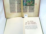 an open book with a picture of a castle on it
