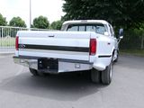 a white truck that is parked in a parking lot
