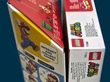 two boxes of nintendo wii games on a blue surface