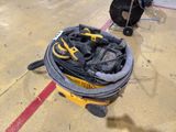 a bucket of tools on the floor of a building