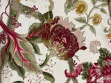 a close up of a bed with a floral pattern on it