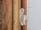 an image of a close up of a piece of wood with peeling paint on it