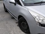 the silver car is parked in the parking lot next to other cars
