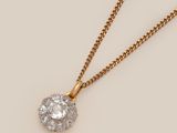 an image of a diamond pendant on a gold chain