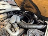 a car engine with a bunch of hoses in it