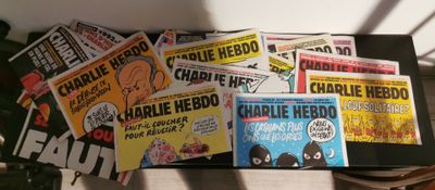 a lot of comic books sitting on a table