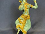 statue of a woman with a flute in her hand