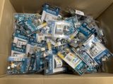 a cardboard box full of electronic gadgets that are in the box