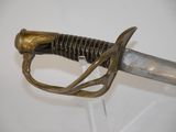 a close up of a sword on display on a table