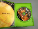 microsoft xbox live game disc in a green case