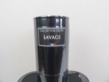 a black cup sitting on top of a black stand