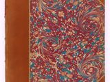 an old book with a floral design on it