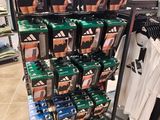 a display of adidas shoes on display in a store