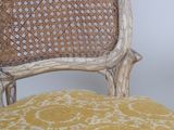 a chair that has a yellow cushion on top of it