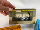 a hand that is holding a box with some items in it