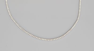 a white pearl beaded necklace on a gray background