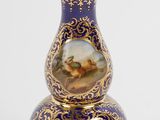 an image of a vase with a picture of a horse and rider on it