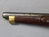 a close up of a knife with a wooden handle on a table