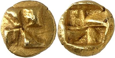 a close up of two gold coins with a cross on them
