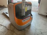 a forklift that is sitting in a garage