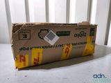 a cardboard box sitting on a table with a sticker on it