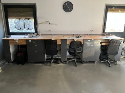 an image of a home office with a desk and chairs