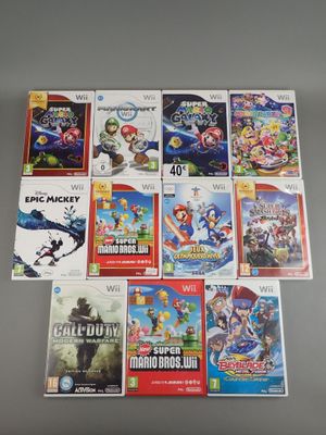 the nintendo wii games are all lined up on the table