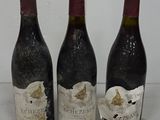 three bottles of wine sitting next to each other on a table