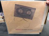 a cardboard box with a picture of a cassette inside of it