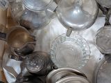 a box full of silver teapots and teapots
