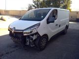 a picture of a white van that is in a parking lot