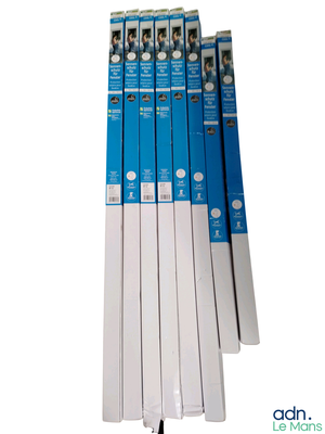 five blue and white boxes of toothpaste on a white background