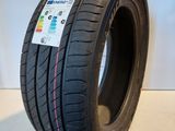 a close up of a tire on a white surface
